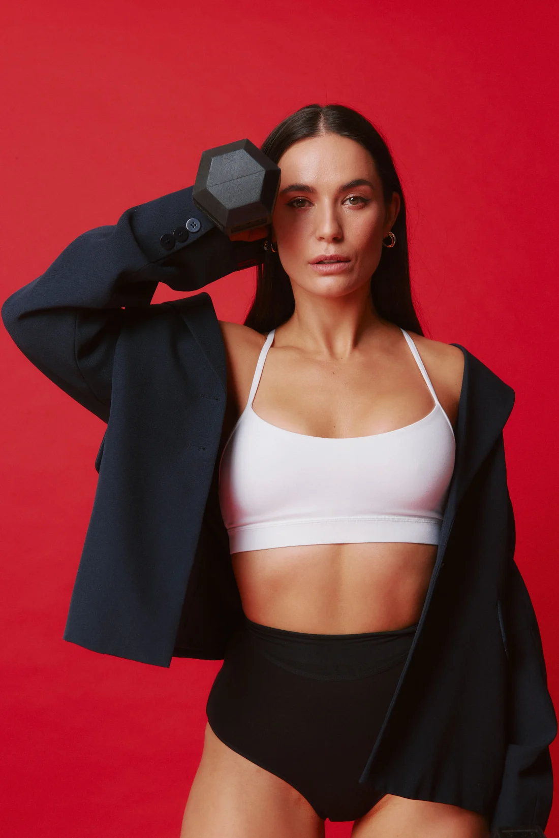 Kobi holding a dumbbell